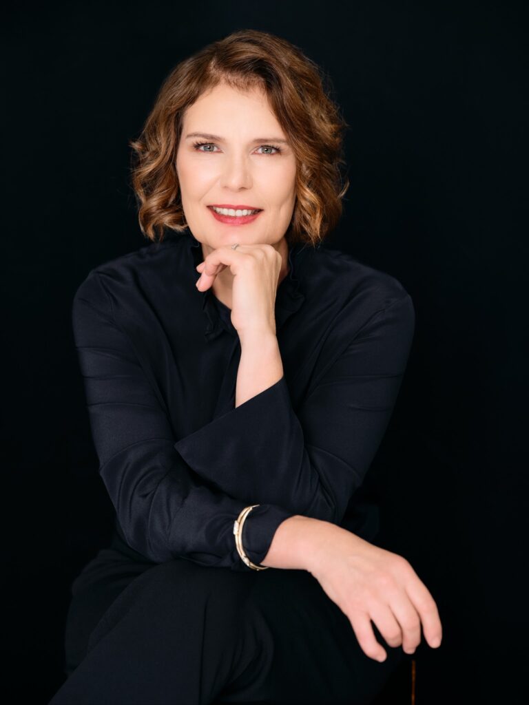 Stephie_sitting_black-background-768x1024